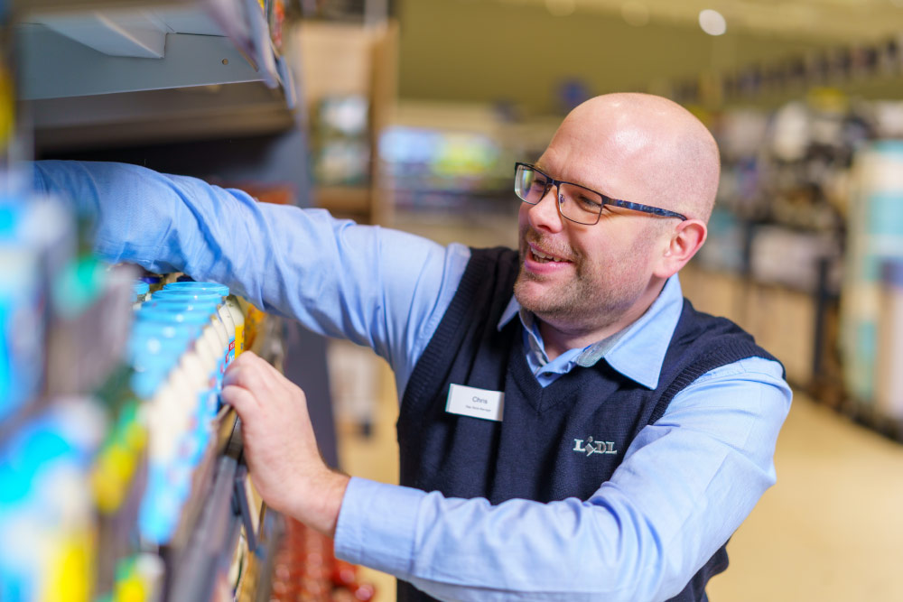 Lidl staff, stacking shelf